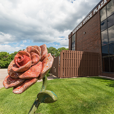 building exterior with rose sculpture